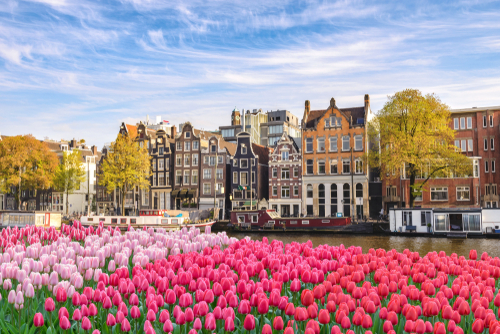 Amsterdam,Netherlands,,City,Skyline,Dutch,House,At,Canal,Waterfront,With